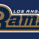 A blue and gold rams logo on top of a white background.